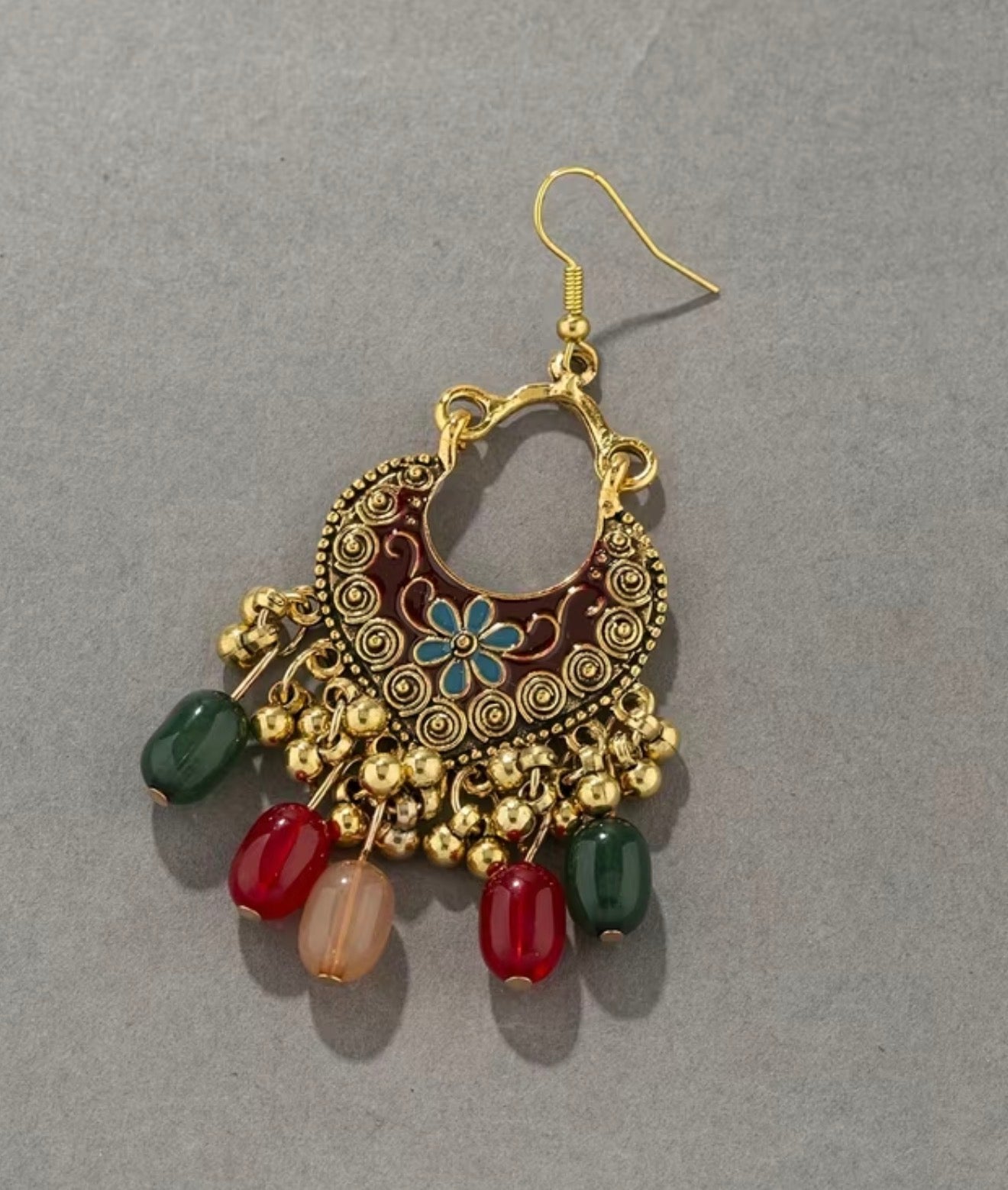 Bohemian-style oxidized silver dangle earrings featuring blue rhinestone centers and beaded tassels